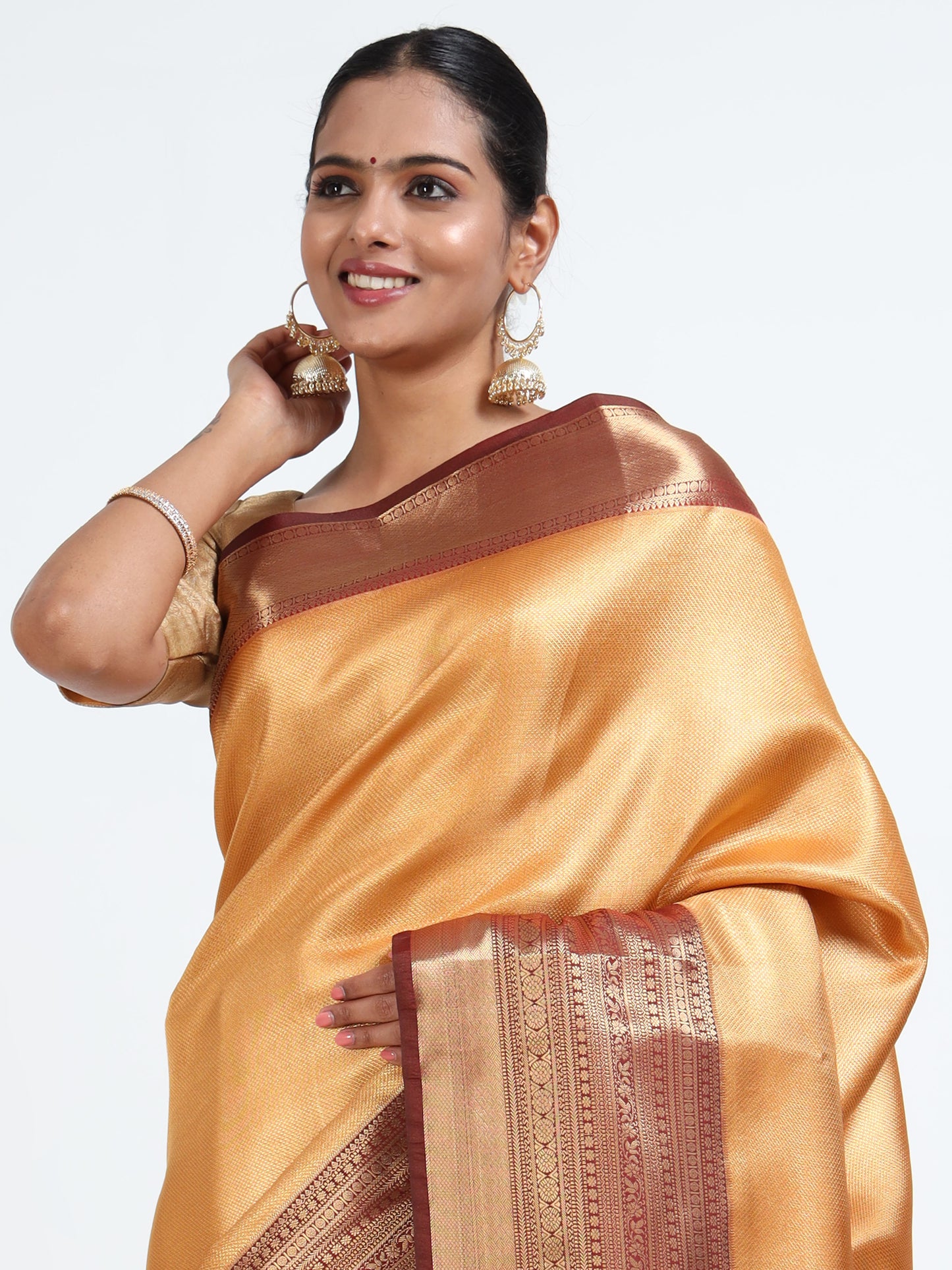 Saffron orange silk saree with matching unstitched blouse